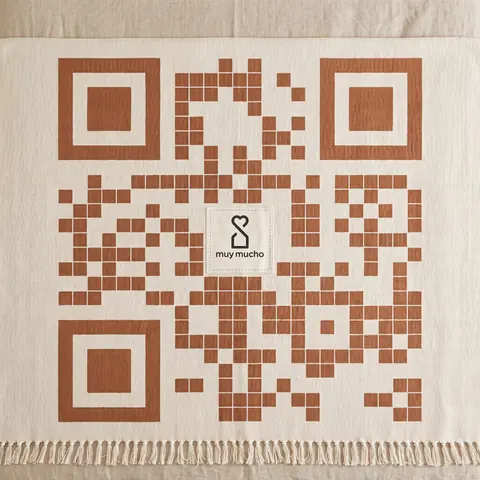 muy mucho code: terracotta modules woven into a striped throw with a sewn label