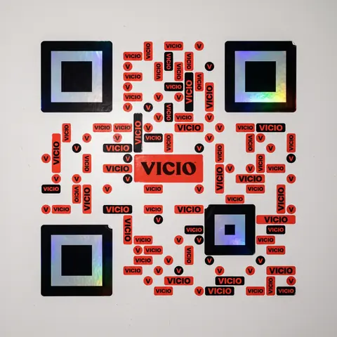 Vicio code: red VICIO die-cut stickers on a pickup door